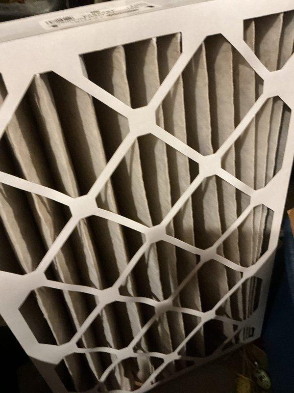 Performed standard furnace tune-up on 23-year-old LP system. Unit is operational but showing significant age-related wear with visible corrosion and buildup inside cabinet. Noted non-functional humidifier and customer's regular flame sensor maintenance. Inspected and verified filter condition, which appeared relatively clean. Recommended comfort advisor consultation and humidifier replacement options.