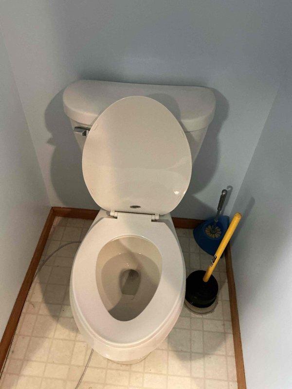 Successfully unclogged toilet using customer's plunger after single attempt. Toilet was completely non-functional prior to service but restored to proper flushing operation.