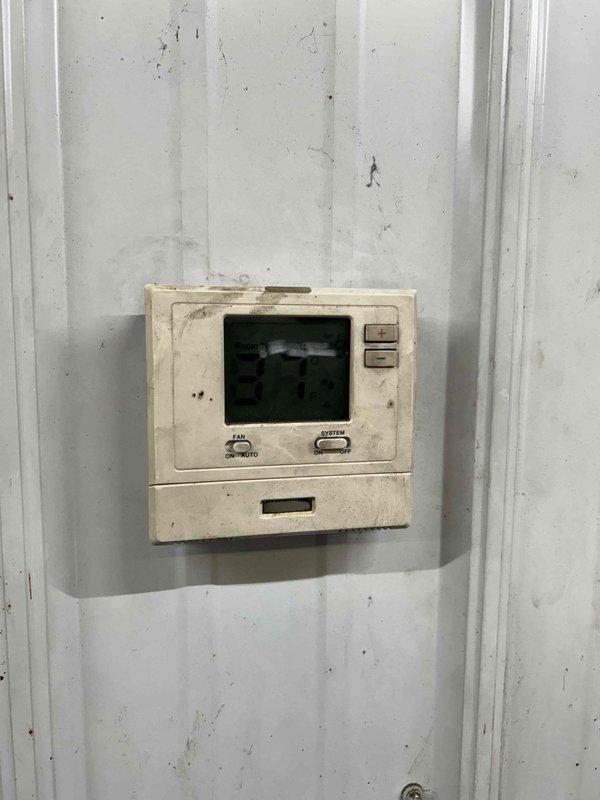 Diagnosed unit heater in shed not receiving call for heat signal. Jumped connection at board to verify furnace functionality. Installed new T4 Honeywell ProSeries thermostat to replace old non-functioning model. Verified proper system operation after installation. Also identified steam humidifier in main house requiring canister replacement; obtained customer approval to order replacement part.