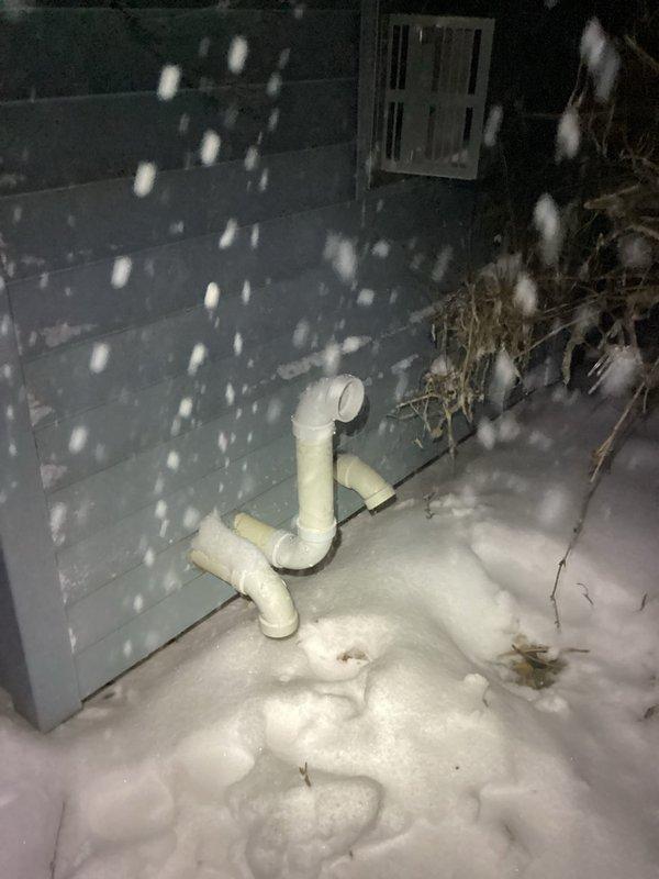 Responded to a no heat service callback where previous service could not identify the issue. Diagnosed furnace failure due to pressure switch activation caused by an obstruction in the exhaust system. Removed rocks from the intake pipe, verified proper pressure readings, and reinstalled exterior components. Unit now operating normally and providing adequate heat to the residence.