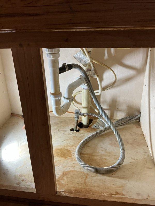 Responded to service call for a clogged kitchen sink drainage issue. Inspected the plumbing system including P-trap and drain connections, then successfully cleared the blockage. Verified proper drainage by testing with running water, confirming complete restoration of normal sink function.