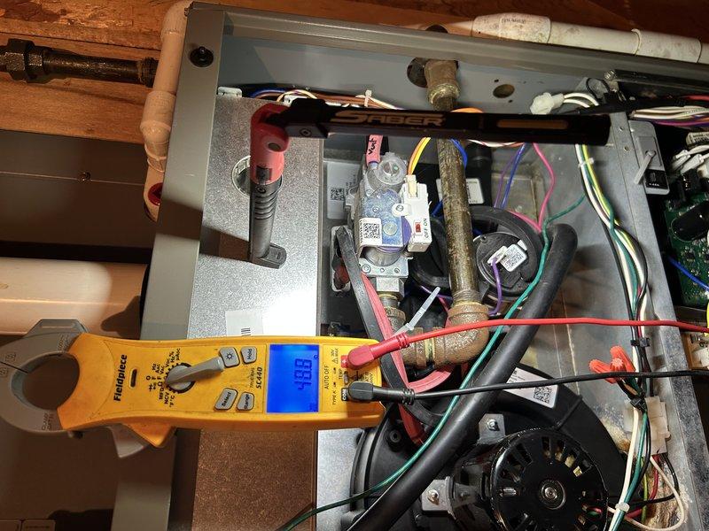 Performed comprehensive furnace maintenance on 14-year-old FRP system. Verified proper temperature rise, cleaned air filter and drain, and inspected routine components. Identified moisture leakage issues from collector box and inducer motor (currently inactive), and documented electrical readings of 8.0 amps with clamp meter. System is currently operating effectively with adequate heating performance.