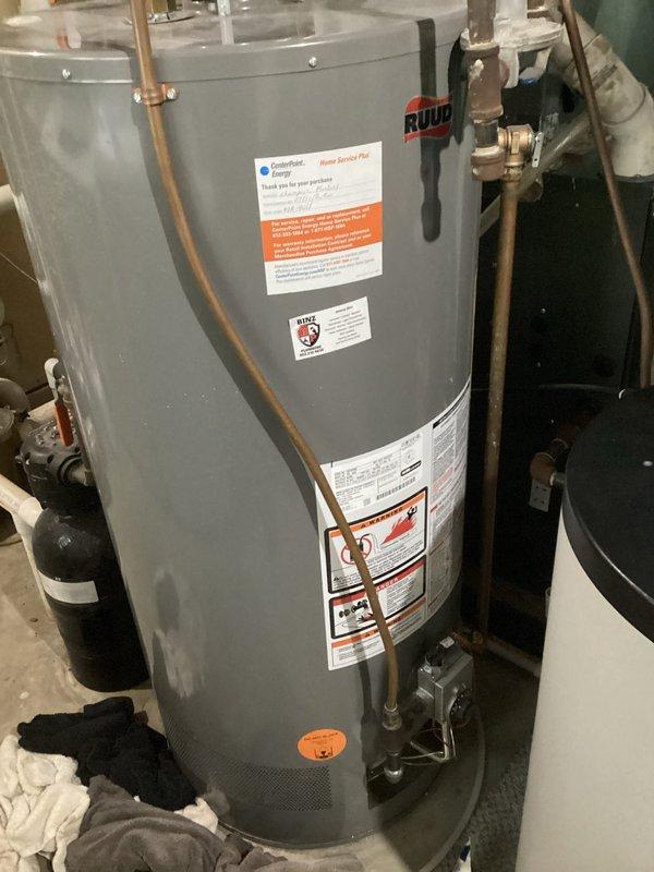 Diagnosed Ruud water heater with active leak from tank bottom. Confirmed unit needs replacement due to tank failure. Provided customer with replacement options and estimates for new water heater installation.