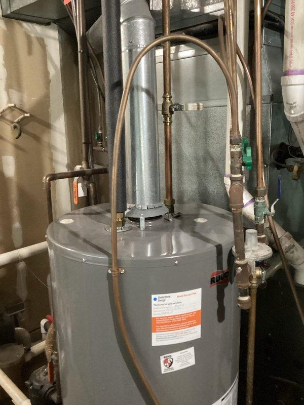 Diagnosed Ruud water heater with active leak from tank bottom. Confirmed unit needs replacement due to tank failure. Provided customer with replacement options and estimates for new water heater installation.