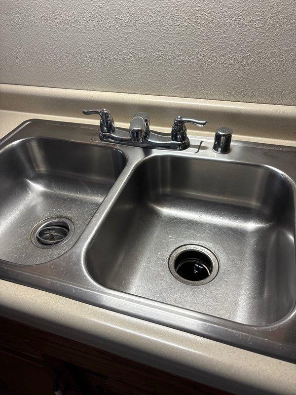Responded to client request for kitchen faucet replacement. Consulted with homeowners on various Moen faucet options while examining existing double-basin stainless steel sink with chrome fixtures. Created multiple estimates and the homeowners selected the premium Moen option.