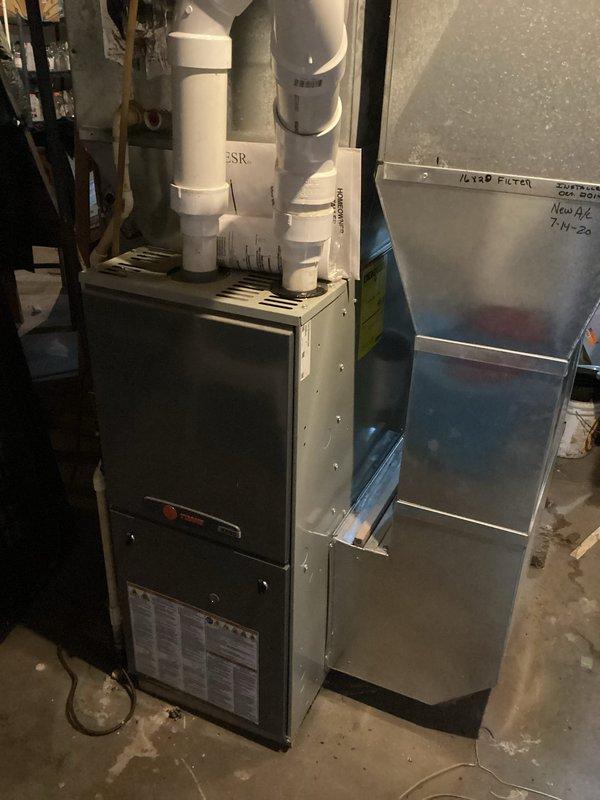 Responded to call for 20+ year-old central boiler blowing cold air. Diagnosed failing circulation pump causing cold pipes and overheating with gravelly noise. Replaced circulation pump as requested by homeowner. System now functioning properly with hot water successfully circulating to the residence.