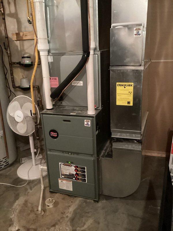 Performed scheduled 8-12 furnace tune-up on 14-year-old Ruud system. Replaced dirty filter, verified blower was clean and balanced with electrical components within specifications. Cleared condensate lines, confirmed proper drainage, and inspected heat exchanger with no compromises found. System tested for 15 minutes with proper gas pressure and 50-degree temperature rise, operating within normal parameters. Discussed equipment age and preventative maintenance benefits with customer.