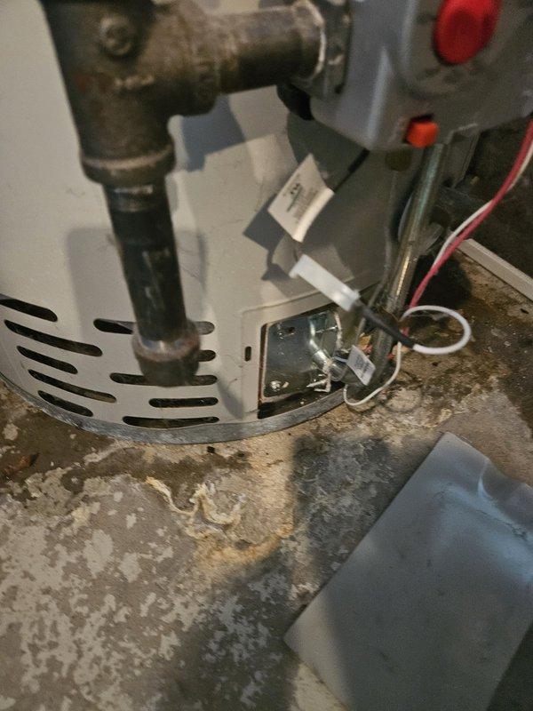 Replaced a 12-year-old Bradford White 40-gallon standard vent water heater that had a cracked tank causing leakage and no hot water supply. Successfully installed a new 40-gallon standard vent unit of similar specifications in the same location, restoring hot water service to the residence.