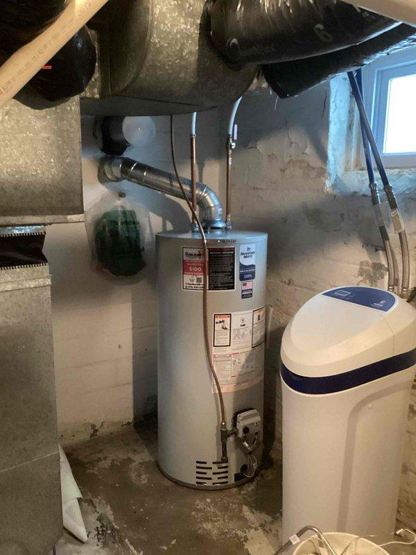 Replaced a 12-year-old Bradford White 40-gallon standard vent water heater that had a cracked tank causing leakage and no hot water supply. Successfully installed a new 40-gallon standard vent unit of similar specifications in the same location, restoring hot water service to the residence.