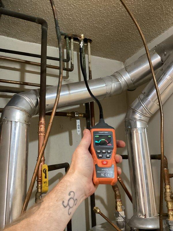 Performed emergency service to decommission and properly secure a natural gas line for customer's conversion from gas to electric appliance. Inspected existing copper gas supply, identified tee connection, and implemented proper termination by installing flared fittings with caps. Verified complete elimination of leaks using TOPTES gas leak detector throughout mechanical room and adjacent piping infrastructure.