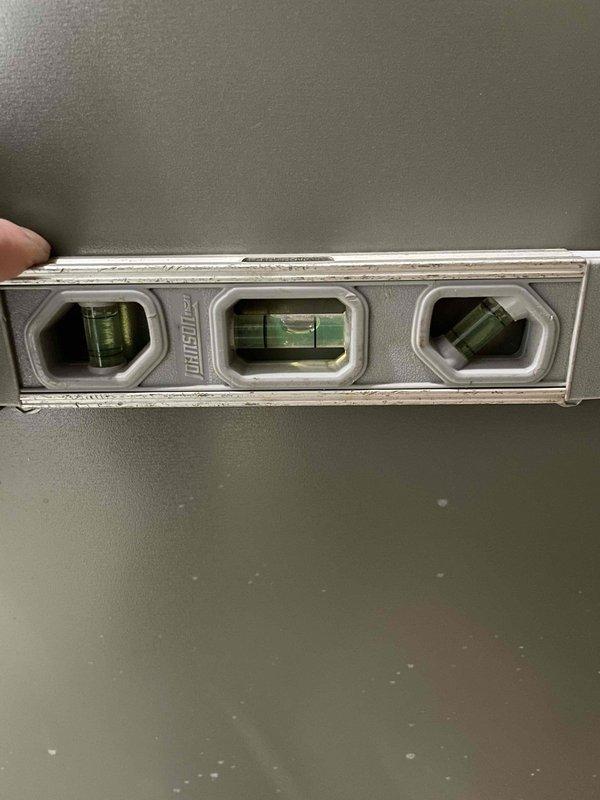 Performed furnace tune-up on a 4-year-old unit that was previously identified as requiring re-leveling. Successfully re-leveled the furnace, which immediately restored proper condensate drainage. Advised homeowner to monitor for any residual water issues over the next few days, though the corrected pitch should prevent further drainage problems.