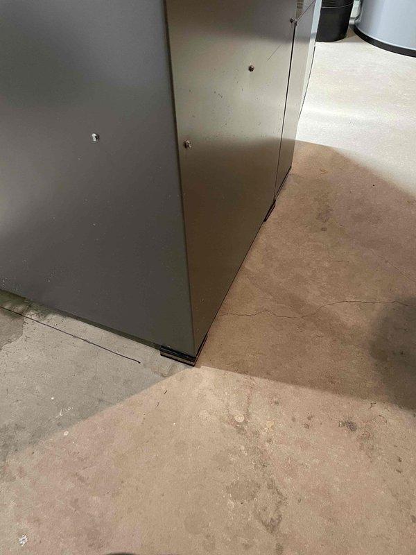 Performed furnace tune-up on a 4-year-old unit that was previously identified as requiring re-leveling. Successfully re-leveled the furnace, which immediately restored proper condensate drainage. Advised homeowner to monitor for any residual water issues over the next few days, though the corrected pitch should prevent further drainage problems.