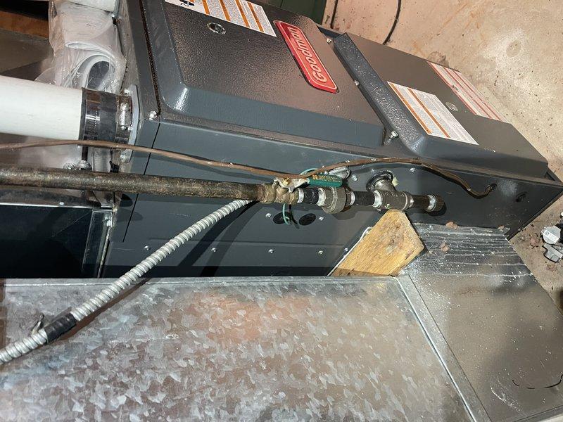 Responded to service call at customer's bunk house for a missing plug on the side of the Goodman furnace, which was likely dislodged during previous gas valve replacement service. Located and reinstalled the missing furnace plug to restore proper operation and system integrity.