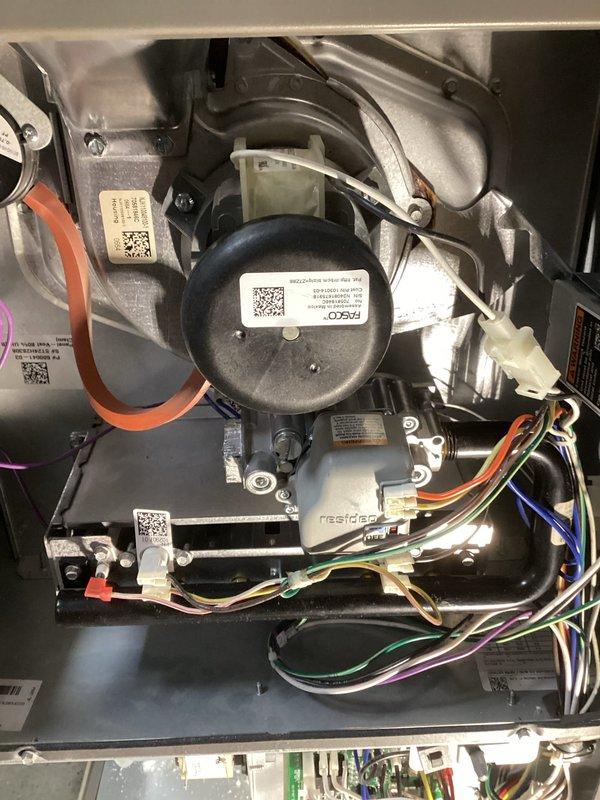 Performed diagnostic assessment on non-functional Lennox furnace exhibiting flame rollout from burner box with subsequent fault shutdown. Visual inspection revealed critical heat exchanger failure with significant cracking in the chamber adjacent to ignitor. Documented equipment condition with photos of heat exchanger, data plate, and furnace for warranty processing.