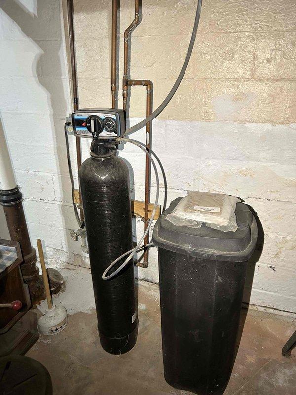 Performed comprehensive furnace tune-up on a unit that had not been operated for 2 years. Inspection revealed properly functioning system with normal operation. Services included heat exchanger inspection, combustion analysis testing, gas pressure verification (both high and low stage), flame sensor and burner inspection, and blower motor evaluation. Secured condensate tube connection after clearing water buildup. Air filter in moderate condition, pressure switch cleaned. Thermostat confirmed operational with adequate heating performance. No immediate concerns identified.