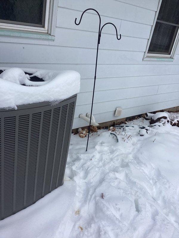 Performed comprehensive furnace tune-up on 4-year-old Lennox FRP system. Inspected all electrical components, cleared condensate lines, verified clean filter and blower assembly. Examined heat exchanger (no compromises found), confirmed proper gas pressures, and checked venting system. Unit operated within specifications with appropriate temperature rise of approximately 60 degrees. Exterior condensing unit observed with substantial snow accumulation.