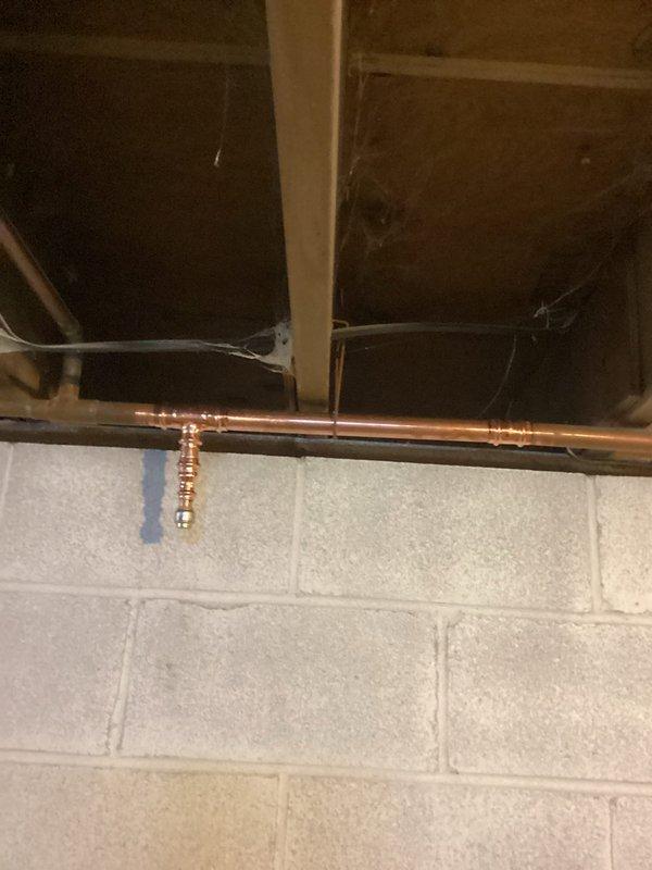 Diagnosed boiler system experiencing insufficient circulation due to air-lock condition. Removed and replaced a section of 1" copper piping as requested by homeowner. Performed system purge to eliminate air entrapment, thawed a blocked baseboard loop restricting flow, and restored normal circulation. Established proper water pressure at 20 psi, verified burner operation and gas pressure. System returned to normal operation with supply and return lines heating correctly. Note: Third zone remains intentionally shut as homeowners are aware and currently remodeling that area.