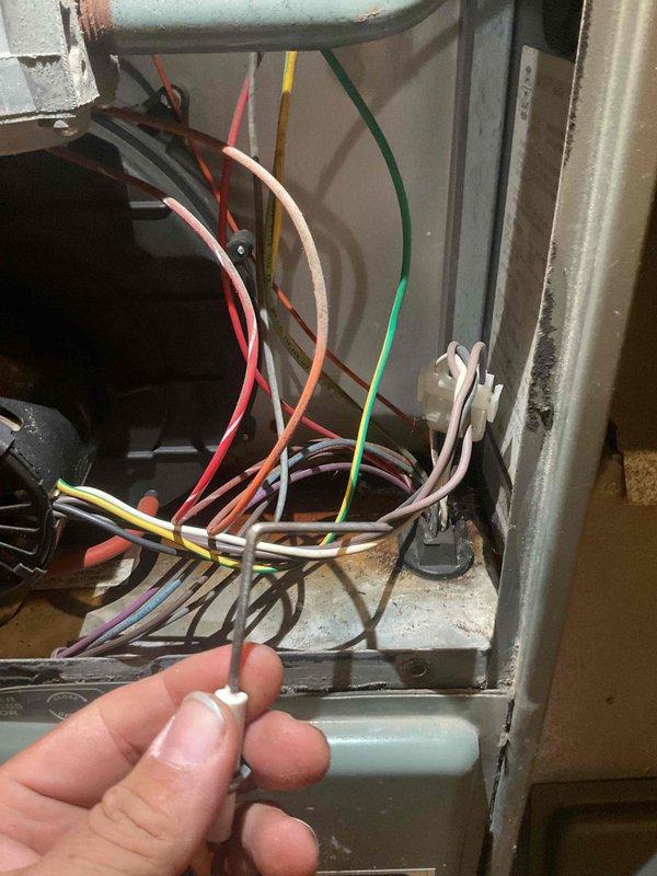 Responded to customer's no heat complaint on a 28-year-old Ruud Achiever 90 Plus natural gas furnace. Diagnostic revealed furnace would ignite but shut down shortly after, with visible water leakage from inducer hoses and significant rust on the inducer motor and pressure switch. Due to age and extensive deterioration, replaced the entire unit rather than attempting repair of the failing components.