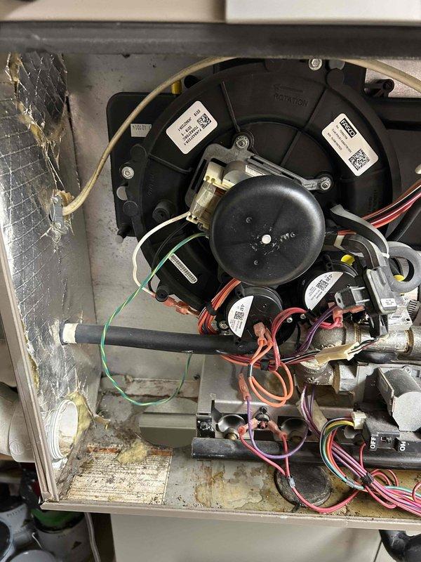 Responded to customer complaint of gurgling noises in furnace exhaust pipe. Diagnosed issue as condensate buildup in the exhaust flue pipe. Repaired and leveled the system, then reattached and secured the detached flue pipe from inducer motor with proper sealing. Test run confirmed resolution with no further gurgling sounds.