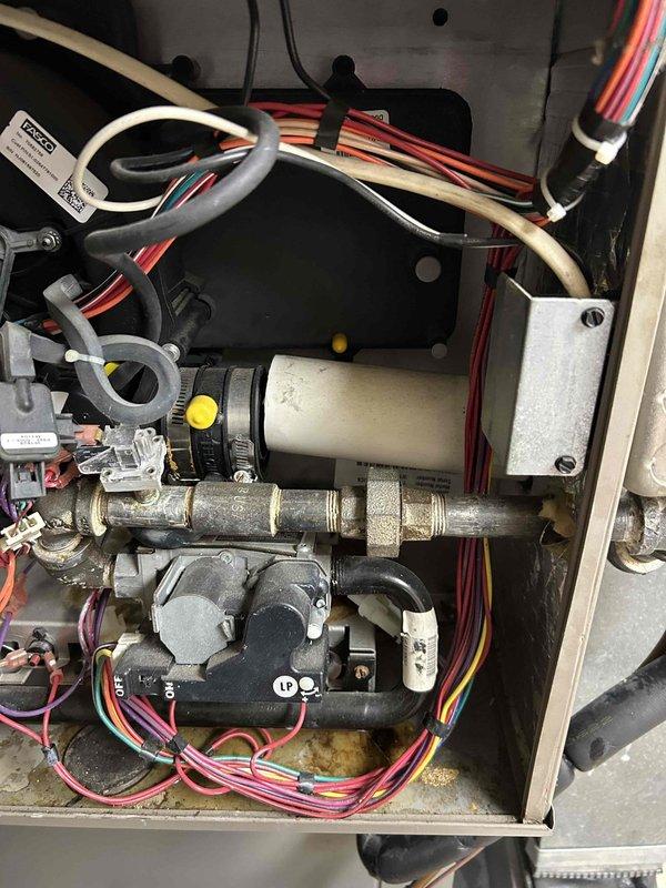 Responded to customer complaint of gurgling noises in furnace exhaust pipe. Diagnosed issue as condensate buildup in the exhaust flue pipe. Repaired and leveled the system, then reattached and secured the detached flue pipe from inducer motor with proper sealing. Test run confirmed resolution with no further gurgling sounds.