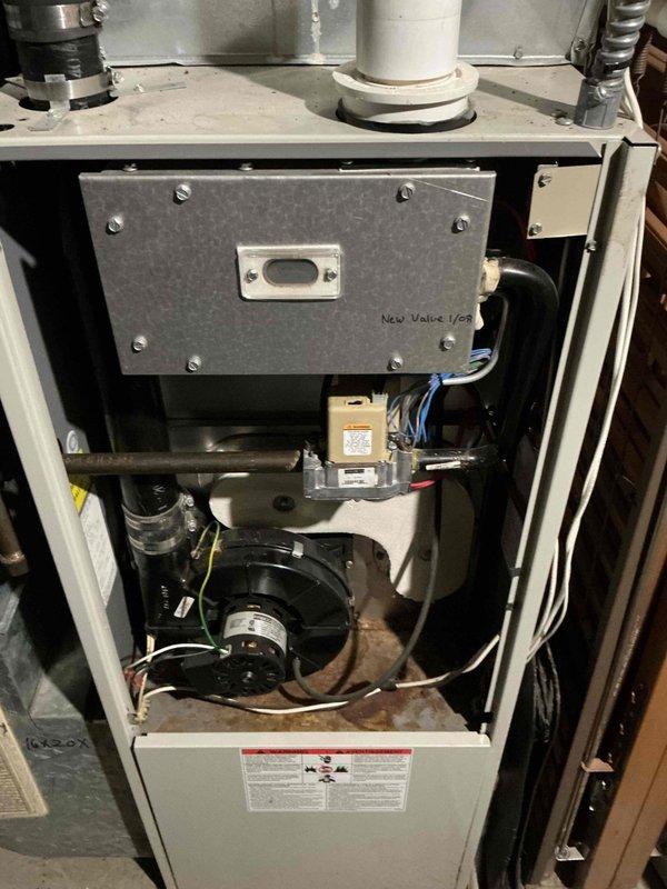 Diagnosed primary heat exchanger failure in 30+ year old forced air furnace. Furnace was experiencing intermittent blower operation. Upon inspection of internal components and electrical connections, identified cracked heat exchanger which poses carbon monoxide safety risk. Tagged equipment as unsafe for operation and scheduled for replacement estimate.