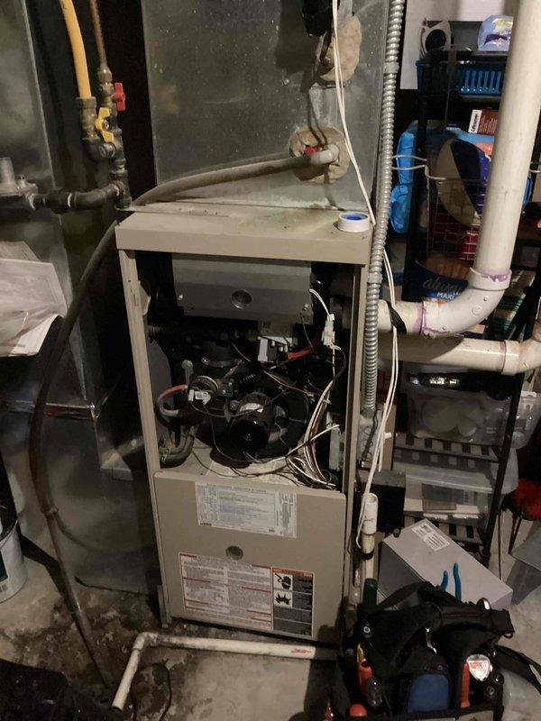 Diagnosed limit switch fault code on 21-year-old furnace. Inspection revealed loose solder joints at limit switch connections on circuit board preventing proper communication. Heat exchanger inspection showed rust accumulation but no immediate failure points. Ordered replacement control board and advised customer that system replacement should be considered within next few years due to unit age and progressive deterioration.