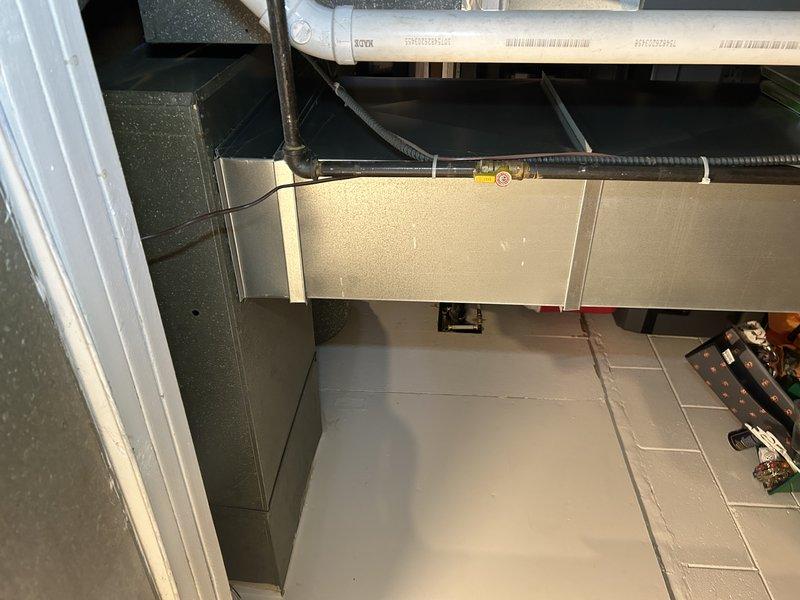 Responded to a service call for a Lennox furnace with reported water leakage. Diagnosed the issue as a condensate drain pipe not properly inserted into the condensate pump, causing water to leak around the furnace area. Repositioned the pump by raising it approximately 1/2" to ensure proper insertion of the PVC drain pipe into the pump reservoir. Inspected secondary heat exchanger to confirm no internal leakage from blower compartment. Recommended duct cleaning service during visit.