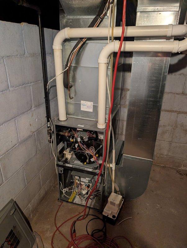 Responded to no-heat call on a 9-year-old furnace exhibiting a "pressure switch open" error code. Diagnosed exterior intake vent was obstructed with snow accumulation, which was cleared to restore proper operation. Performed comprehensive tune-up including heat exchanger inspection (no compromises found) and confirmed 60°F temperature rise with normal system cycling both with access panels removed and installed.