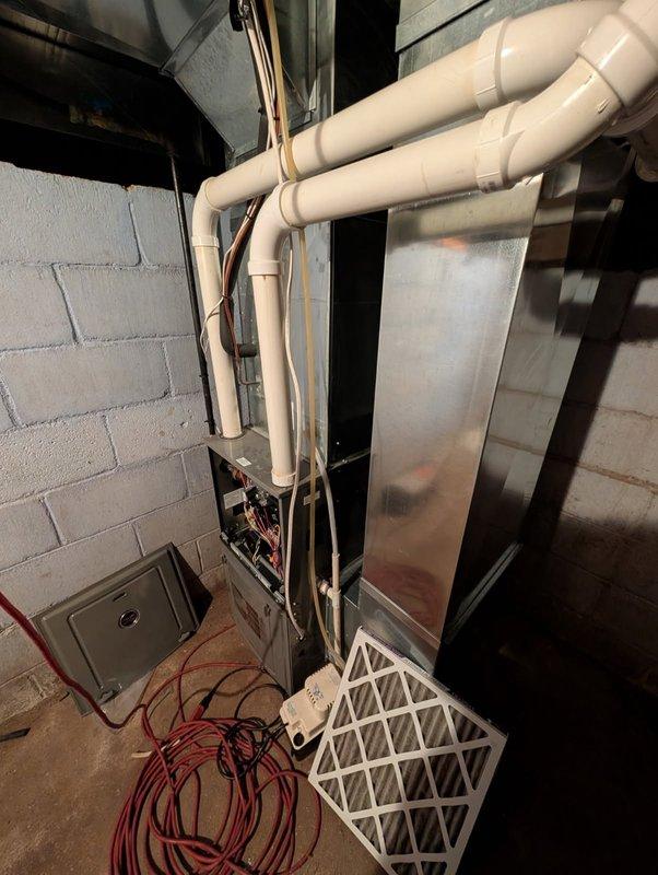 Responded to no-heat call on a 9-year-old furnace exhibiting a "pressure switch open" error code. Diagnosed exterior intake vent was obstructed with snow accumulation, which was cleared to restore proper operation. Performed comprehensive tune-up including heat exchanger inspection (no compromises found) and confirmed 60°F temperature rise with normal system cycling both with access panels removed and installed.