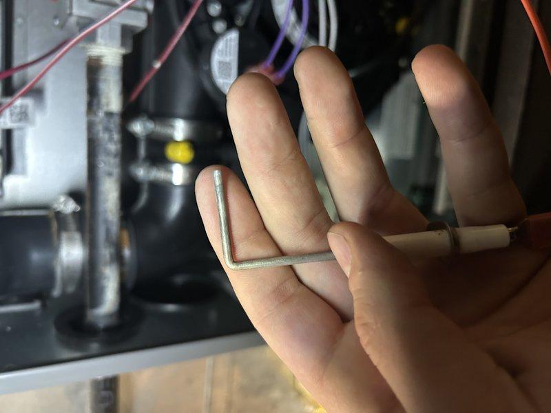 Responded to no heat call on a 7-year-old Honeywell system. Determined thermostat was in delay mode, not malfunctioning. Performed complete tune-up including cleaning components, checking venting for snow buildup, clearing condensate drain, and replacing improperly installed air filter. Verified proper gas pressure, temperature rise, and heat exchanger condition. System now operating normally.