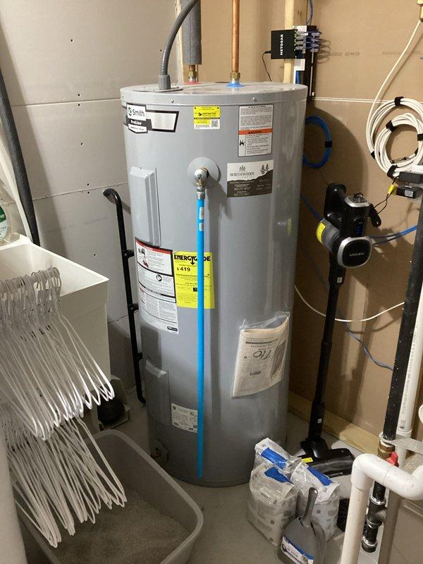Conducted comprehensive plumbing inspection of residential property. Verified water heater installation in utility area with proper copper and PVC connections. All plumbing systems found to be in good working condition with no issues requiring repair.