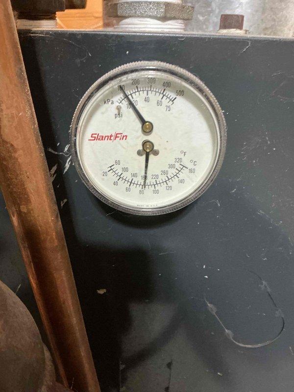 Responded to service call regarding sticking oiler valve on customer's Slant/Fin boiler. Diagnosed zone valve stuck in open position causing improper system operation. Replaced faulty zone valve and verified proper system pressure (within operational range on pressure/temperature gauge). System now functioning correctly.