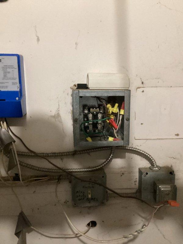 Diagnosed failed Tekmar control board in building 1400 boiler system that had caused complete heat loss to multiple apartments. Implemented temporary repair by installing two relays and a time delay circuit to bypass damaged board contacts, successfully restoring circulation pump operation and heat production. Set water pressure on both boilers to 20 PSI and ordered replacement control board for permanent repair during follow-up visit.