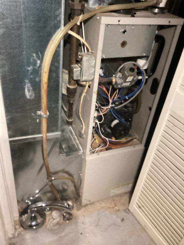 Responded to no-heat call for 23-year-old forced air furnace that had been inoperative for approximately one week. Diagnostic testing revealed a faulty rollout switch and defective blower motor requiring replacement. Heat exchanger was inspected with scope and found to be intact despite the unit's age; customer opted for component repair rather than system replacement.