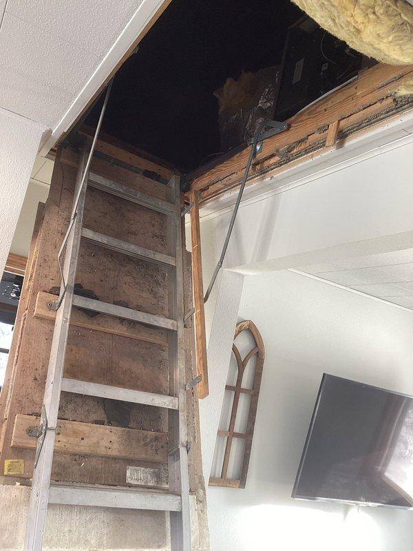 Responded to no heat complaint in upstairs apartment. Diagnosed furnace in attic with continuously running fan but no heat production. Located and repaired loose Molex connection on control board. Tested system operation multiple times with wire movement to verify repair stability. Inspected heat exchanger - no defects found. System now operating properly with heat restored. Advised customer about potential board replacement if issue recurs.