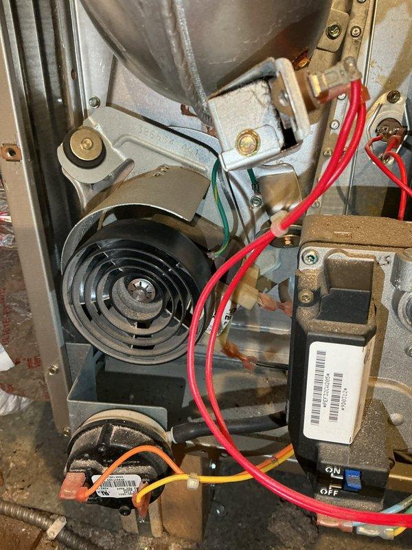 Responded to no heat complaint for 12-year-old furnace. Upon inspection, found multiple critical failures including failed inducer motor, oil-leaking blower motor, and control board with visible burn marks. Complete furnace replacement performed due to extent of damage and system age.