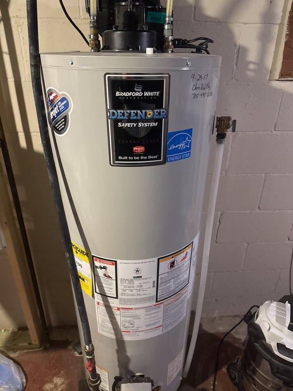 Diagnosed Bradford White Defender water heater with no hot water issue. Discovered pressure switch code error and ice-cold blower motor with ice buildup around ports, similar to previous year's problem. Shortened exhaust vent closer to house and installed 90-degree elbow with protective screen. Provided customer with replacement options for pressure switch, blower motor, and complete water heater unit.