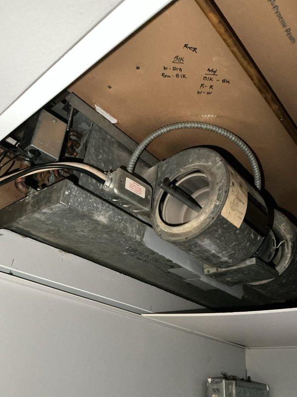 Responded to no heat complaint for aging fan coil boiler system. Upon inspection, determined that all components are functioning correctly, but unit is unable to maintain desired temperature (currently reading 66°F) due to poor thermal envelope. Identified that supply vents are positioned adjacent to drafty window and glass sliding door, causing significant cold air infiltration that reduces heating efficiency. Advised customer that system limitations cannot be overcome without addressing building envelope issues.