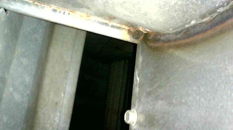 Responded to no-heat service call for aging furnace system. Diagnosed and cleared plugged condensate line, which was preventing proper operation. Performed heat exchanger inspection with no definitive defects found, though burners showed significant wear. System restored to proper heating function; customer was informed about potential future replacement considerations due to unit age and burner condition.