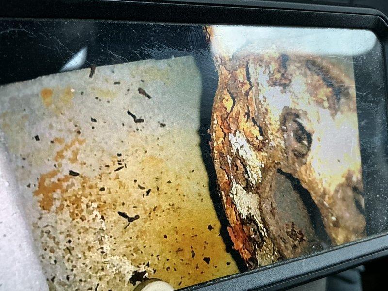 Diagnosed 14+ year old Amana furnace with no heat operation. Inspection revealed severe corrosion on burners, suspected heat exchanger leak above high limit, and failing inducer motor. Observed incomplete combustion cycle where ignition would initiate but not sustain. Documentation included photos of extensive corrosion damage and compromised metal fittings. Recommended complete furnace replacement due to multiple critical component failures and age of system.