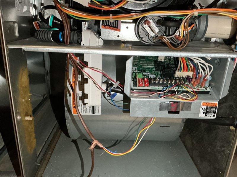 Responded to a no heat complaint in a vacant property with furnace short cycling due to overheating. Diagnosed multiple issues: inducer draft motor failing and causing improper exhaust ventilation, incorrectly sized filter boot restricting proper airflow, and excessive gas pressure in low fire (over 2" wc, above the 1.3"-1.7" manufacturer range). Adjusted gas pressure down to 1.38" wc, removed filter, and restored proper heat operation with extended run cycles.