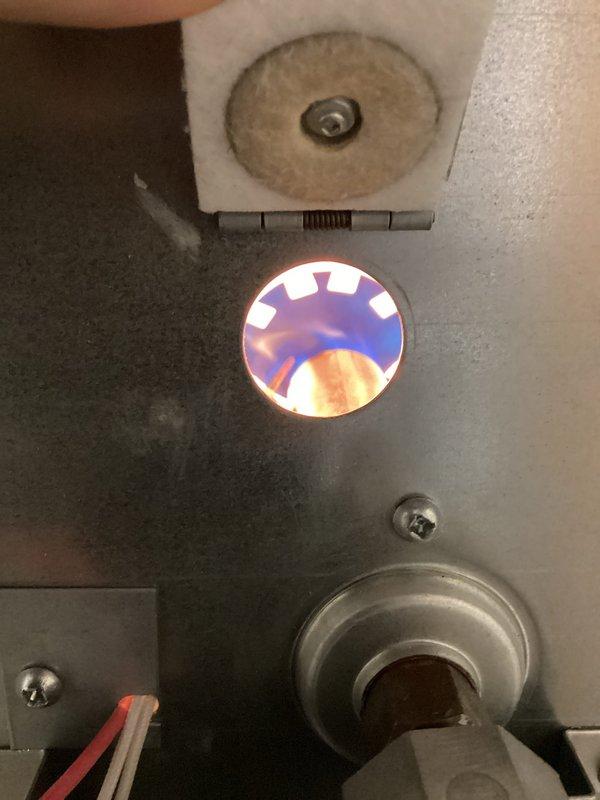 Responded to no-heat complaint on 1.5-year-old Revolv furnace in mobile home. Diagnostic inspection revealed failed ignitor. Replaced ignitor with stock from service vehicle and verified proper system operation. Furnace now firing correctly with normal flame pattern observed through sight glass. No charge to customer as unit is under warranty period.