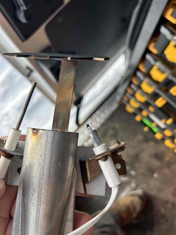 Responded to no-heat complaint on 1.5-year-old Revolv furnace in mobile home. Diagnostic inspection revealed failed ignitor. Replaced ignitor with stock from service vehicle and verified proper system operation. Furnace now firing correctly with normal flame pattern observed through sight glass. No charge to customer as unit is under warranty period.