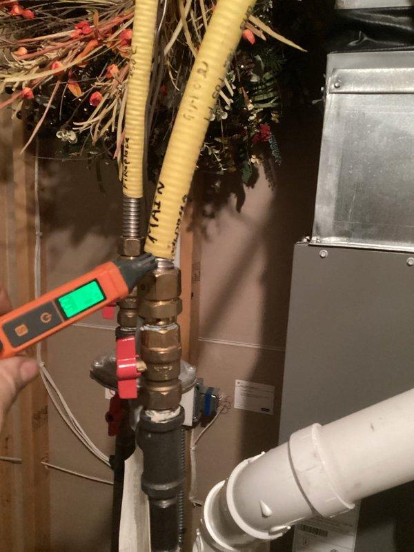 Responded to warranty service call for CO2 alarm activation in recently installed furnace. Investigation revealed blocked venting system due to improperly secured termination fittings that were not glued, causing ice buildup below the gooseneck and resulting in high carbon monoxide readings with low O2 levels. Repaired venting connections, tested system operation in both high and low fire modes, and verified safe operation after repairs.
