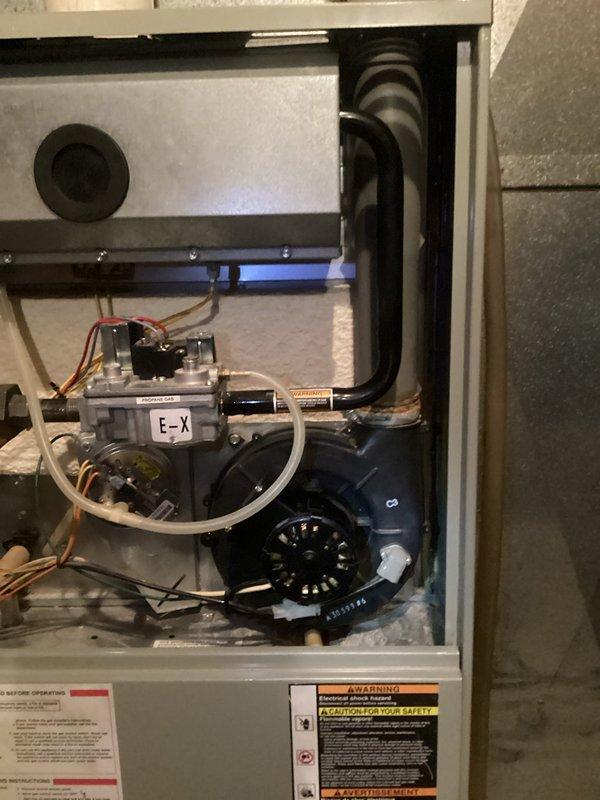 Performed comprehensive furnace tune-up on 25-year-old system. Identified several concerning components including blower with excessive play, capacitor degradation (15μF reading 12.3μF), problematic inducer motor operation, severely corroded flame exchanger, and defective inducer capacitor (4μF reading 0.6μF). Heat exchanger inspection revealed no compromises. Verified system operation with proper gas pressures and 60° temperature rise. Recommended replacement of both motors and scheduled advisor visit to discuss system replacement options due to age and repair costs.