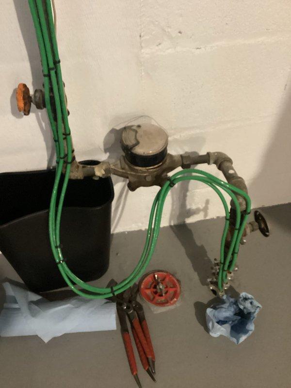 Responded to service call regarding leaking shut-off valve on incoming water line. Performed inspection of the plumbing system, which revealed significant leakage from the 12-4 shut-off valve. Green supply pipes showed signs of aging and mineral deposits at connection points. Temporarily addressed immediate leak issue and scheduled follow-up appointment for complete repipe service.