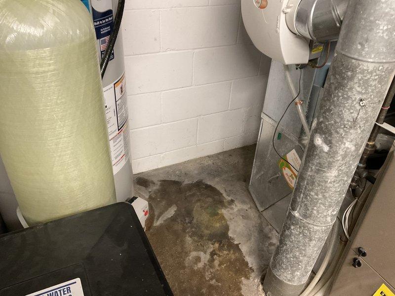 Relocated customer's water heater to improve access to furnace filter. Performed complete disconnection, draining, and repositioning of unit to leftmost possible position, then reconnected water supply lines and 2" PVC vent piping. All connections tested and verified operational.