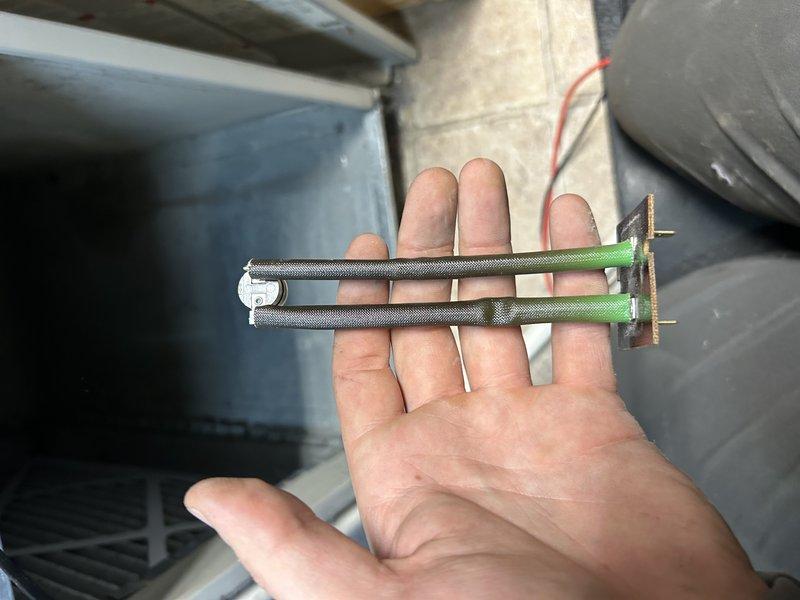 Responded to no heat call for 12-4 NG Gibson furnace. Diagnosed open limit/rollout switch fault with furnace sitting cold. Found main limit switch with abnormal resistance (4-5 ohms) showing signs of overheating, and capacitor measuring 2 μF despite 5 μF rating. Noted additional issues including oil-leaking blower motor, dirty blower wheel restricting airflow, evaporator coil buildup, and intermittent burner ignition. Assessment suggests oversized furnace (80,000 BTU) for the home's ductwork system.