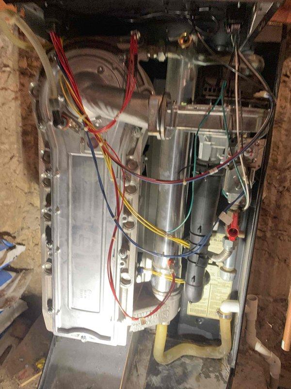 Responded to no-heat call on aging boiler system. Found unit in lockout condition. Performed comprehensive maintenance including flushing condensate drain, cleaning ignitor, verifying settings, and resetting maintenance reminder. Successfully restored system operation, confirming proper heating in domestic hot water mode, Unico system, and radiant heat circuits.