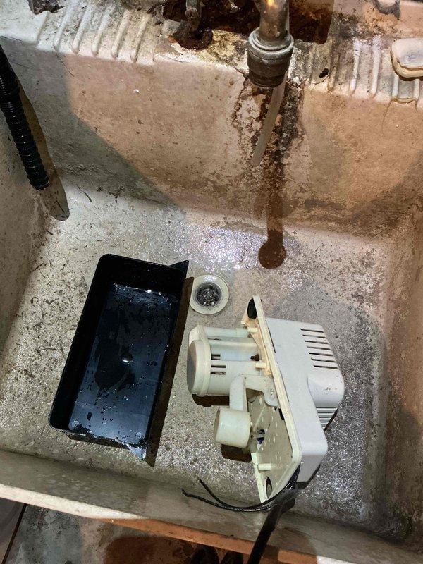 Responded to service call for water pooling under customer's older furnace. Diagnosed overflow issue with condensation pump that had tripped the GFCI. Cleaned the pump thoroughly and reset power to resolve the issue.